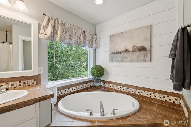 19409 90th Avenue Ct E, Graham, WA 98338 - bathroom with vanity, a bath, and tasteful backsplash