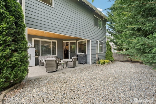 19409 90th Avenue Ct E, Graham, WA 98338 - rear view of house with an outdoor living space and a patio