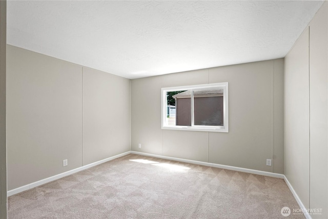602 29th St SE Unit 39, Auburn, WA 98002 - carpeted empty room featuring baseboards