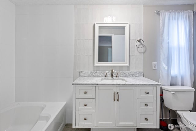 602 29th St SE Unit 39, Auburn, WA 98002 - full bath with toilet, a bath, vanity, and tile walls
