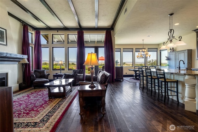 2316 Ridgeview Rd, Walla Walla, WA 99362 - living area featuring dark wood-type flooring, a chandelier, and a glass covered fireplace