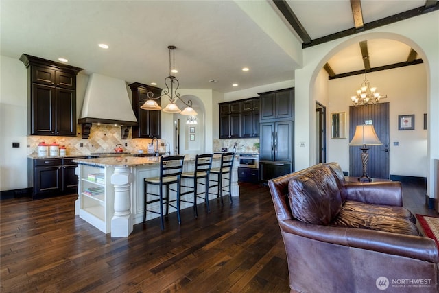 2316 Ridgeview Rd, Walla Walla, WA 99362 - kitchen with custom range hood, arched walkways, open floor plan, open shelves, and recessed lighting