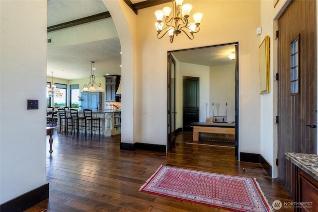 2316 Ridgeview Rd, Walla Walla, WA 99362 - foyer featuring a chandelier, dark wood-type flooring, and arched walkways