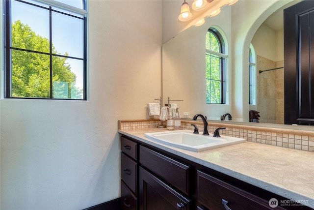 2316 Ridgeview Rd, Walla Walla, WA 99362 - bathroom featuring vanity, a shower, and decorative backsplash