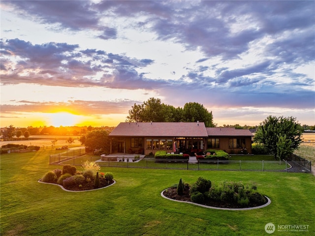 2316 Ridgeview Rd, Walla Walla, WA 99362 - back of house at dusk featuring a fenced backyard and a patio area
