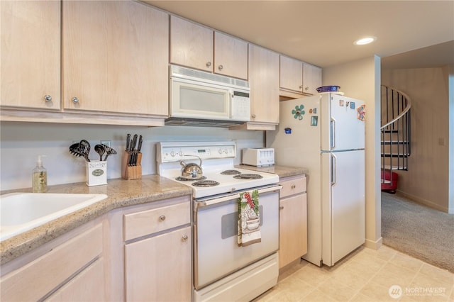 103 N Park St Unit 341, Chelan, WA 98816 - kitchen with white appliances, recessed lighting, light brown cabinetry, baseboards, and light carpet