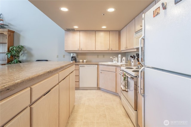 103 N Park St Unit 341, Chelan, WA 98816 - kitchen with white appliances, light brown cabinets, light countertops, recessed lighting, and a sink