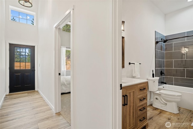 10642 Merry Canyon Rd, Leavenworth, WA 98820 - ensuite bathroom featuring vanity, wood finished floors, toilet, and bathing tub / shower combination
