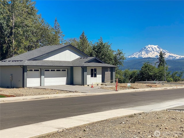 17615 142nd Ave E Unit 14, Puyallup, WA 98374 - single story home with a mountain view, an attached garage, a shingled roof, and driveway