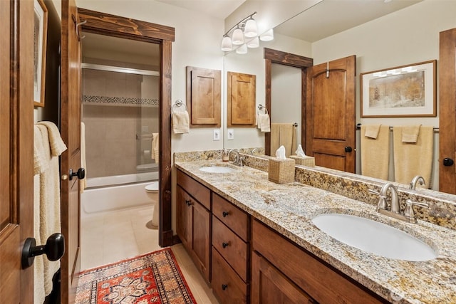 420 Black Nugget Ln, Cle Elum, WA 98922 - bathroom featuring toilet, double vanity, tile patterned flooring, and washtub / shower combination