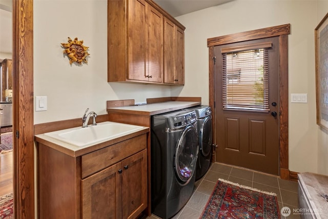 420 Black Nugget Ln, Cle Elum, WA 98922 - washroom with cabinet space, washer and dryer, and dark tile patterned floors