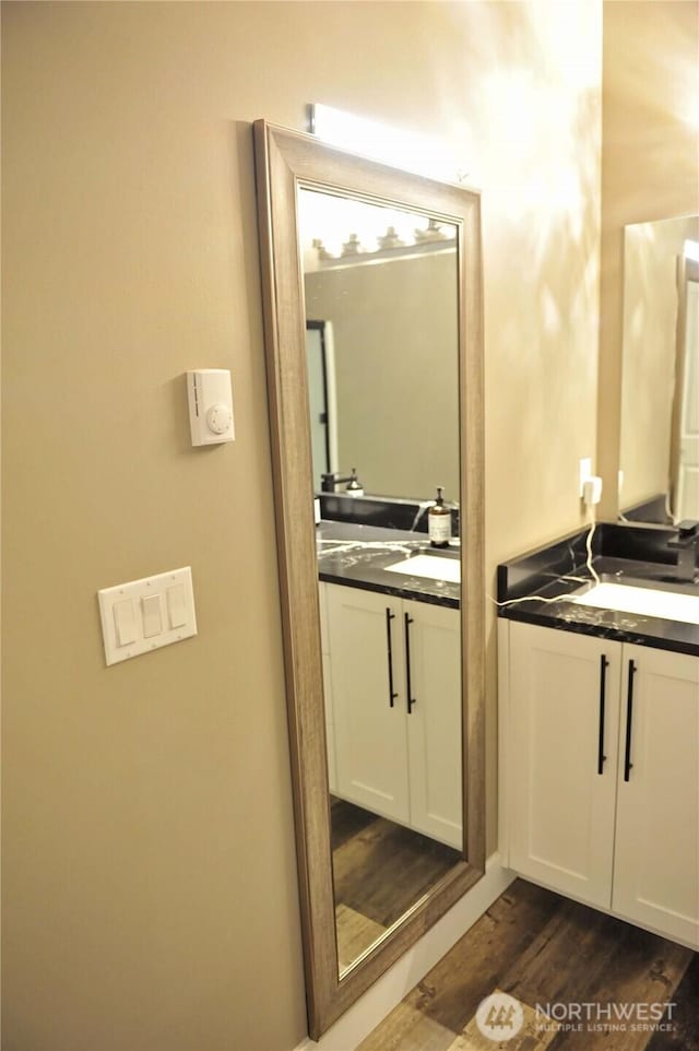 613 Aster Ct SE, Ocean Shores, WA 98569 - bathroom with vanity and wood finished floors