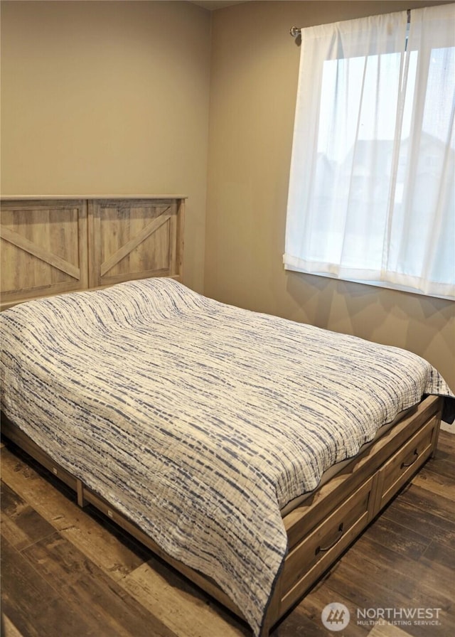 613 Aster Ct SE, Ocean Shores, WA 98569 - bedroom with dark wood-type flooring