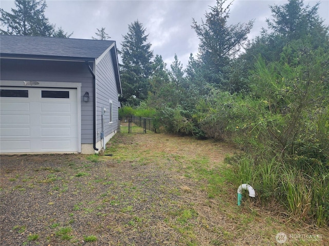 613 Aster Ct SE, Ocean Shores, WA 98569 - view of yard with a garage