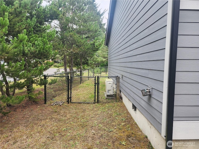 613 Aster Ct SE, Ocean Shores, WA 98569 - view of yard featuring a gate