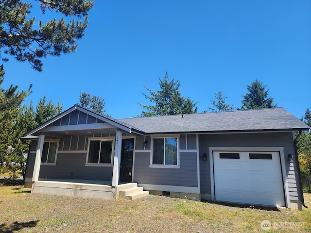 613 Aster Ct SE, Ocean Shores, WA 98569 - single story home featuring an attached garage, covered porch, a shingled roof, and board and batten siding