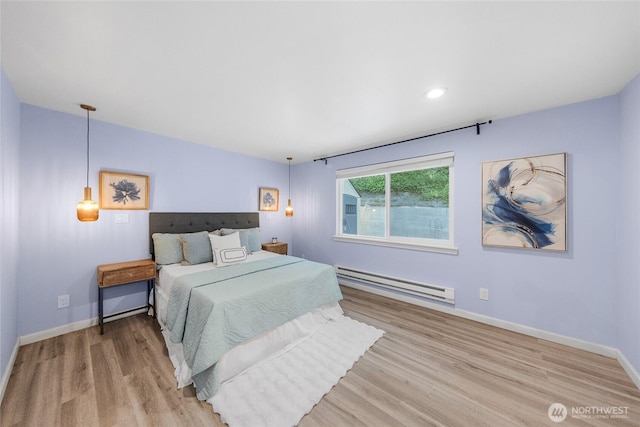 2463 74th Ave SE, Mercer Island, WA 98040 - bedroom featuring baseboard heating, wood finished floors, and recessed lighting