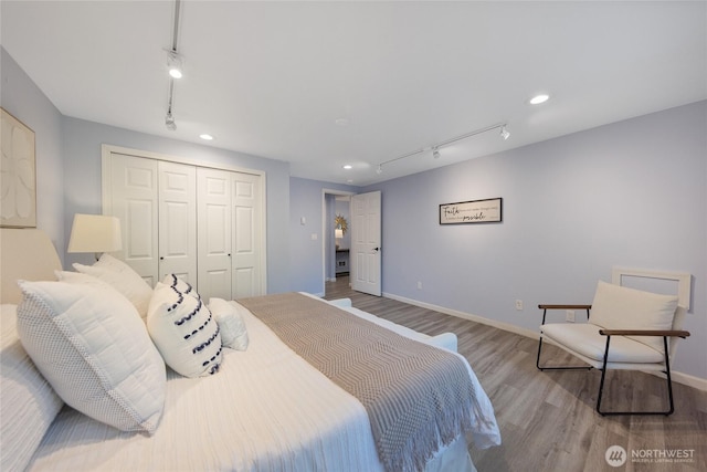 2463 74th Ave SE, Mercer Island, WA 98040 - bedroom with track lighting, wood finished floors, a closet, and recessed lighting