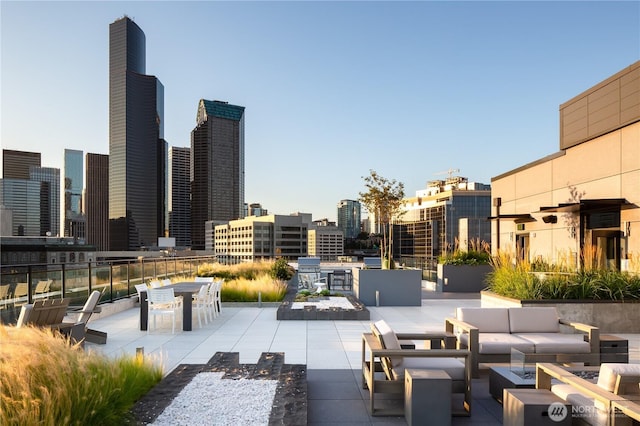 450 S Main St Unit 1405, Seattle, WA 98104 - view of community with an outdoor hangout area, a patio area, and a skyline view