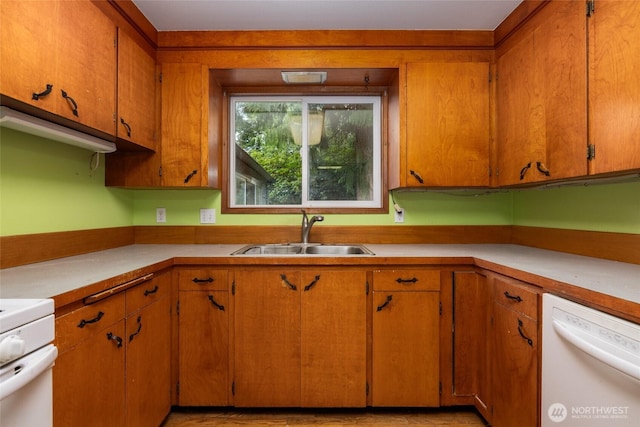 7823 Parker Rd, Sedro Woolley, WA 98284 - kitchen with dishwasher, light countertops, range, and brown cabinetry