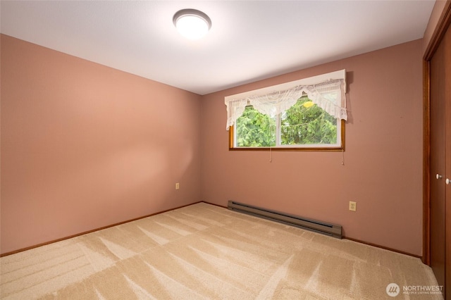 7823 Parker Rd, Sedro Woolley, WA 98284 - carpeted empty room with a baseboard heating unit and baseboards