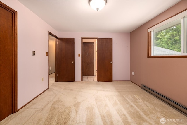 7823 Parker Rd, Sedro Woolley, WA 98284 - unfurnished bedroom featuring baseboard heating and light carpet