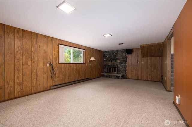 7823 Parker Rd, Sedro Woolley, WA 98284 - below grade area featuring wooden walls, a baseboard heating unit, carpet floors, and a fireplace