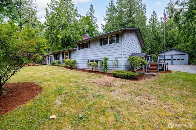 7823 Parker Rd, Sedro Woolley, WA 98284 - tri-level home featuring an outbuilding, a garage, a front lawn, and a chimney