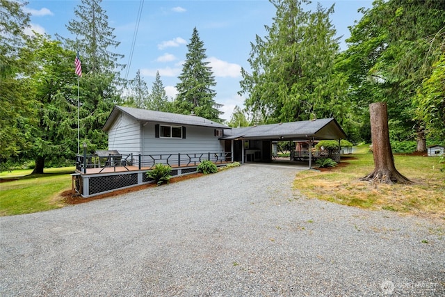 7823 Parker Rd, Sedro Woolley, WA 98284 - view of front of house featuring gravel driveway, a deck, and a front lawn