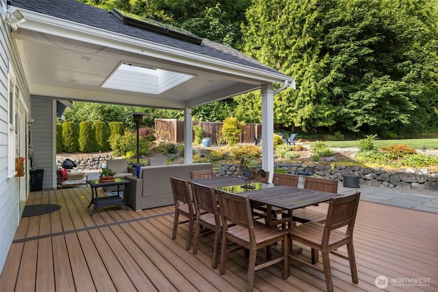 6817 Picnic Point Rd, Edmonds, WA 98026 - wooden terrace featuring a gazebo, outdoor dining space, and an outdoor hangout area