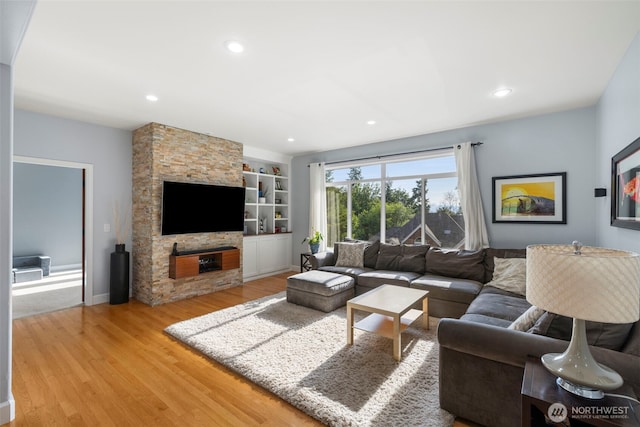 6817 Picnic Point Rd, Edmonds, WA 98026 - living area featuring light wood-style floors, built in shelves, recessed lighting, and baseboards