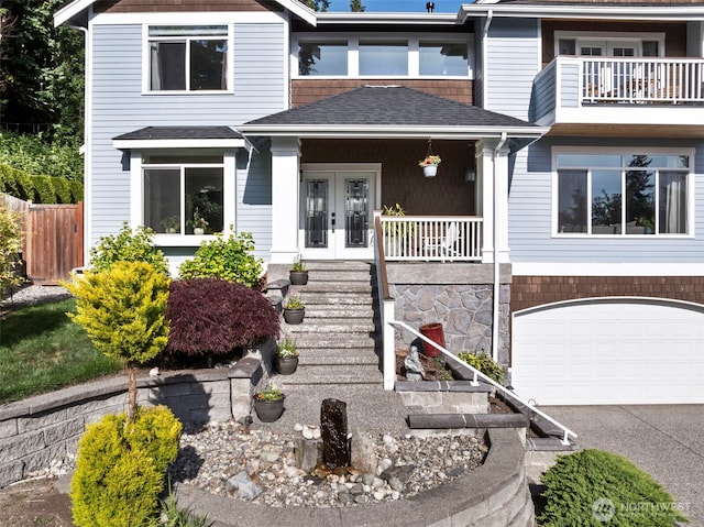 6817 Picnic Point Rd, Edmonds, WA 98026 - view of front of home with french doors, driveway, an attached garage, a shingled roof, and a porch