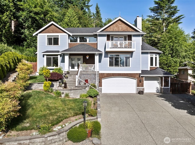 6817 Picnic Point Rd, Edmonds, WA 98026 - view of front of house with a balcony, a chimney, a garage, driveway, and french doors