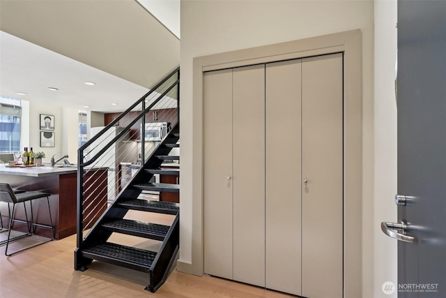 900 Lenora St Unit W106, Seattle, WA 98121 - stairs featuring wood finished floors and recessed lighting