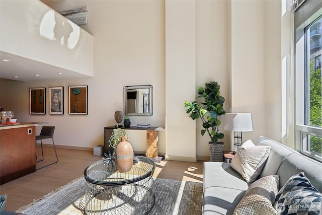 900 Lenora St Unit W106, Seattle, WA 98121 - living area with a towering ceiling, wood finished floors, and recessed lighting