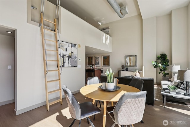 900 Lenora St Unit W106, Seattle, WA 98121 - dining space featuring wood finished floors and a high ceiling