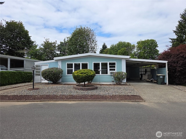 1350 Alonda Ln NE, Olympia, WA 98516 - manufactured / mobile home with driveway and an attached carport