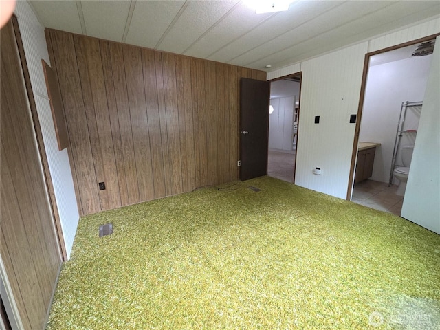 1350 Alonda Ln NE, Olympia, WA 98516 - unfurnished room featuring light colored carpet and wood walls