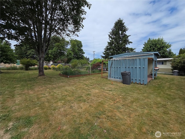 1350 Alonda Ln NE, Olympia, WA 98516 - view of grassy yard with a garden and a storage unit