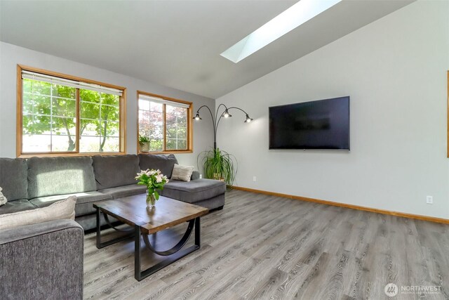 6002 35th Way SE, Auburn, WA 98092 - living room with a skylight, lofted ceiling, and light wood-style flooring