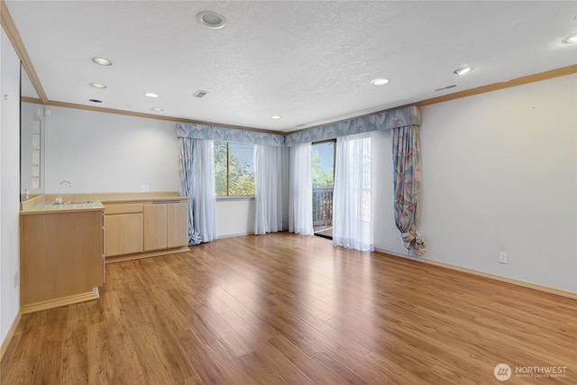 4026 SW 328th St, Federal Way, WA 98023 - unfurnished living room with crown molding, light wood-style flooring, recessed lighting, and a textured ceiling