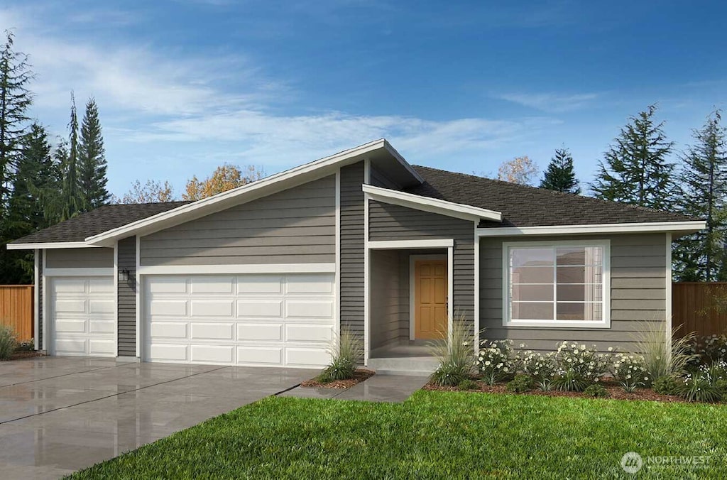 13442 185th Street Ct E Unit 115, Puyallup, WA 98374 - view of front of home with an attached garage, concrete driveway, and roof with shingles
