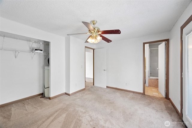12244 NE 136th Pl, Kirkland, WA 98034 - unfurnished bedroom featuring carpet floors, a closet, a textured ceiling, and ceiling fan