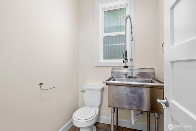 2575 Bretland Rd, Camano Island, WA 98282 - bathroom with toilet, baseboards, and tile patterned flooring