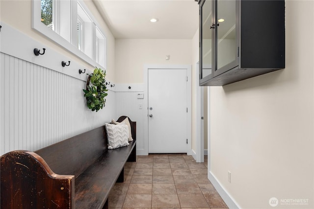 2575 Bretland Rd, Camano Island, WA 98282 - mudroom with baseboards and light stone finish floors