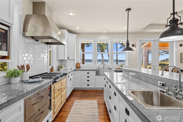 2575 Bretland Rd, Camano Island, WA 98282 - kitchen with island exhaust hood, a sink, dark wood-style flooring, pendant lighting, and recessed lighting