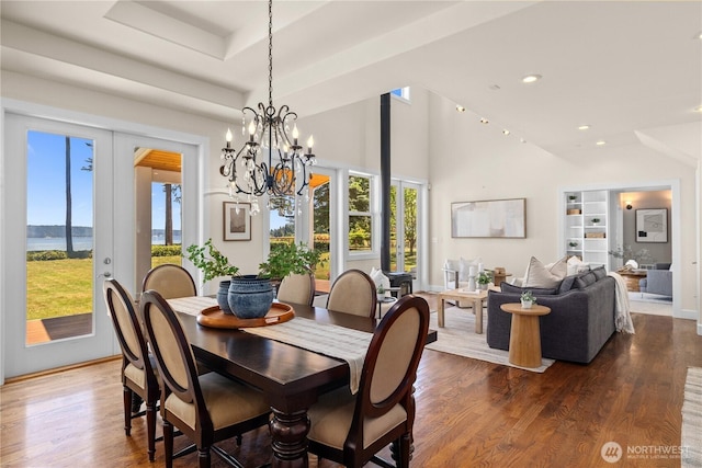 2575 Bretland Rd, Camano Island, WA 98282 - dining room with healthy amount of natural light, wood finished floors, a chandelier, recessed lighting, and high vaulted ceiling