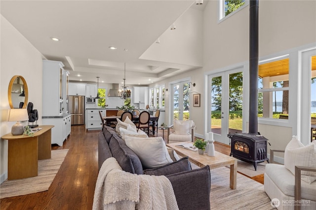 2575 Bretland Rd, Camano Island, WA 98282 - living room with a wood stove, wood finished floors, healthy amount of natural light, recessed lighting, and a chandelier