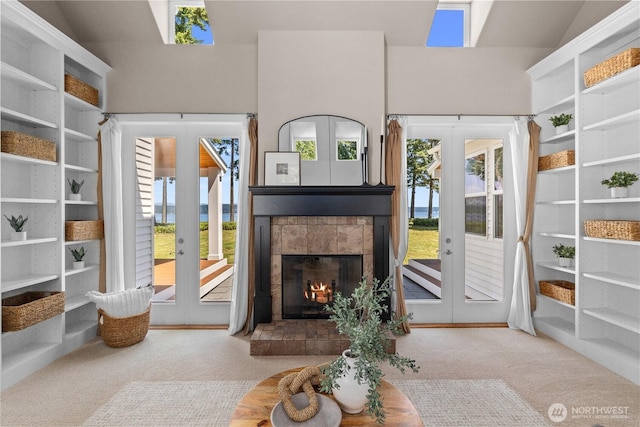 2575 Bretland Rd, Camano Island, WA 98282 - carpeted living room with french doors and a tile fireplace