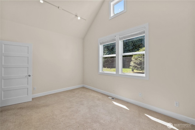 2575 Bretland Rd, Camano Island, WA 98282 - unfurnished room with carpet flooring, baseboards, high vaulted ceiling, and rail lighting